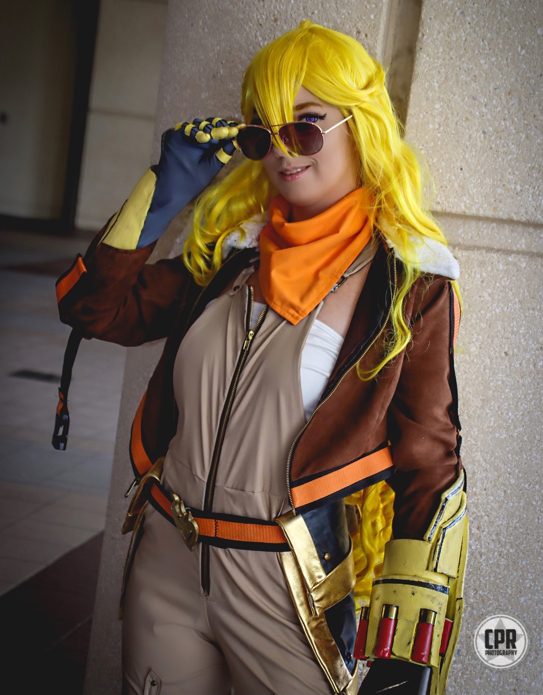 Christina modeling the full Yang Costume, looking over the top of a pair of aviator sunglasses