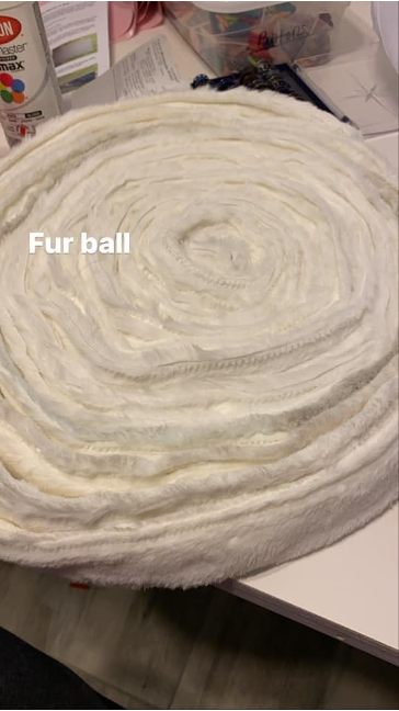 Photo of the coil of prepared fur trim with the text: "Fur ball"